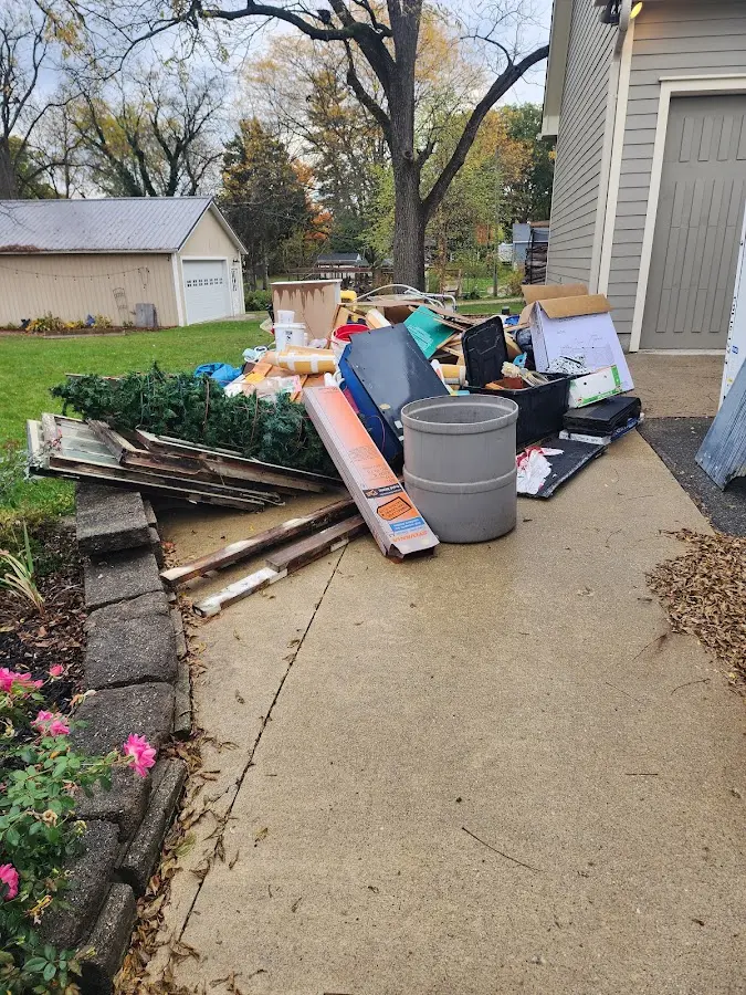 Dumpster being loaded with debris for Roofing Dumpster Rental in Hopewell